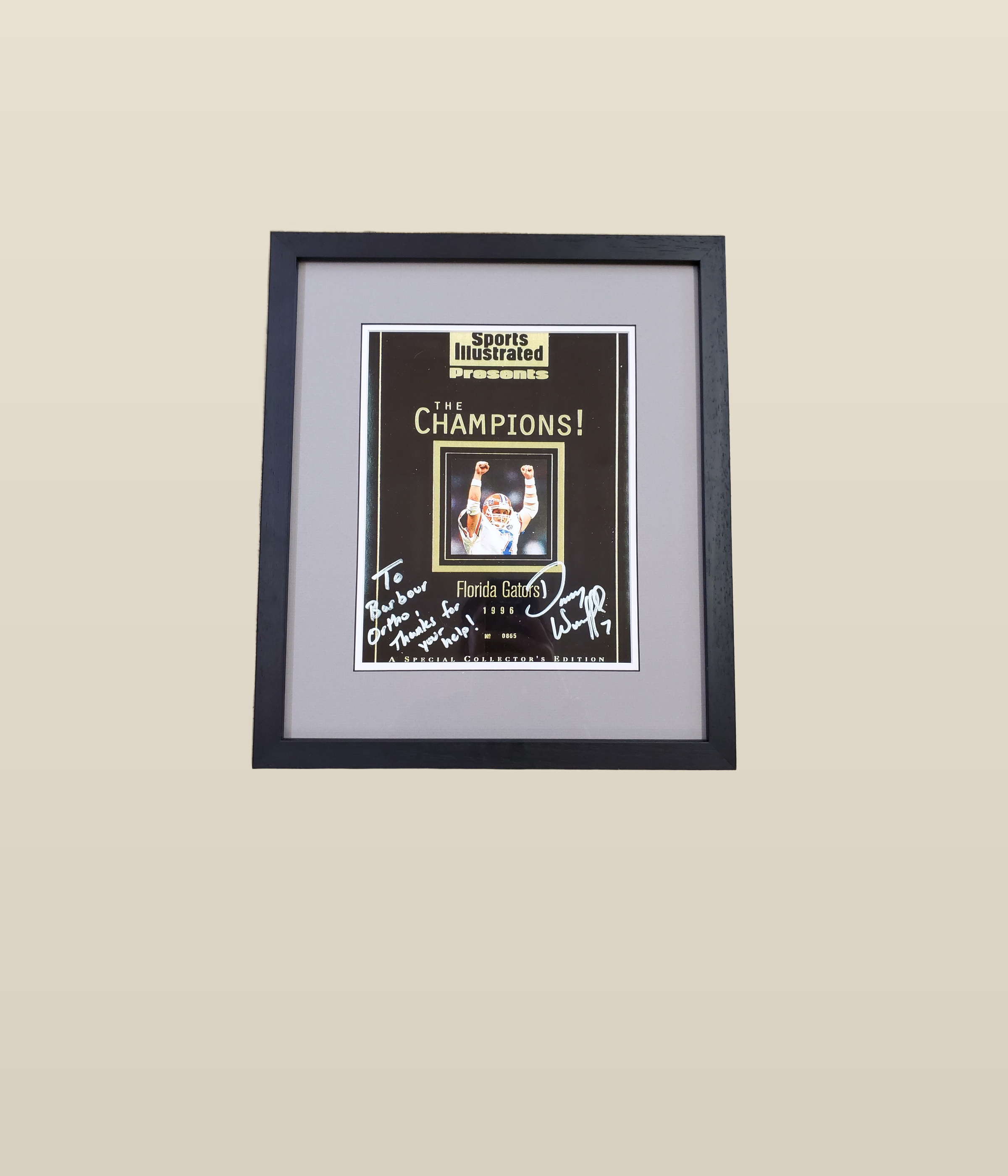 Framed sports memorabilia and jersey shadow box